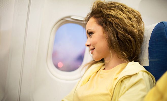 Woman looking out window