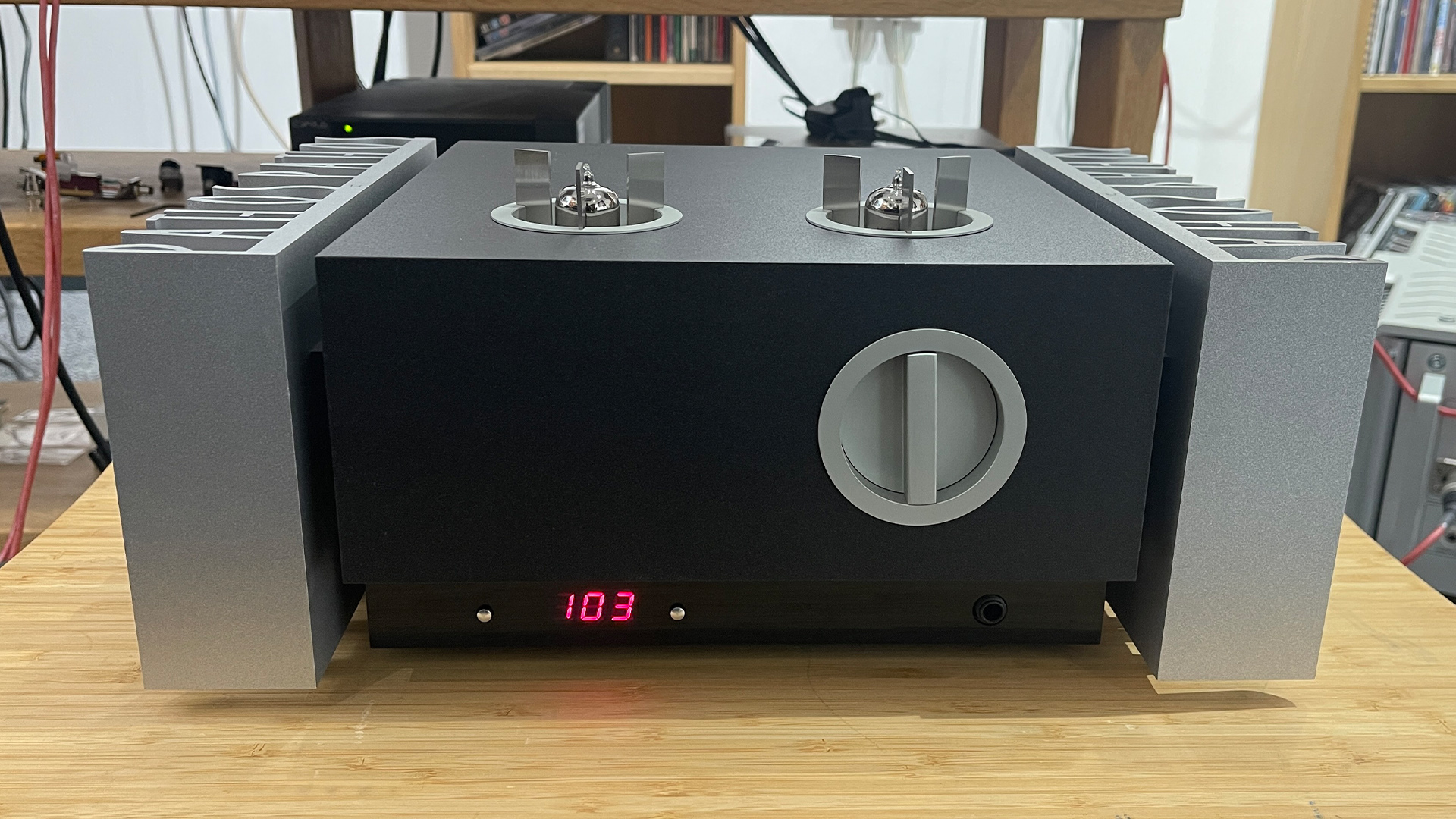 Pathos Inpol Remix MkII integrated amplifier on wooden hi-fi rack in test room