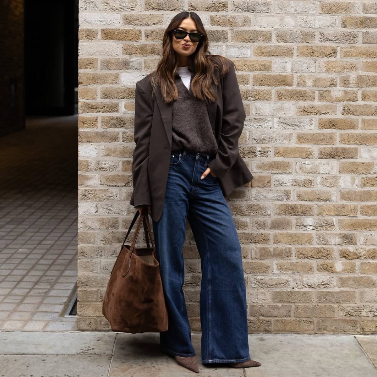 Vanessa wearing brown jumper