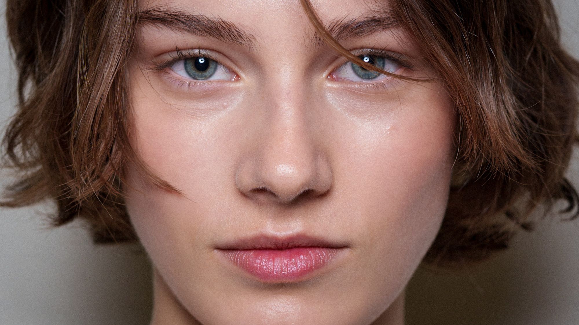 a close up of a model's skin backstage at Aje - dehydrated skin
