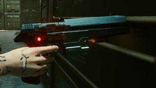 A closeup of Johnny Silverhand's gun, a futuristic sidearm, in Cyberpunk 2077.