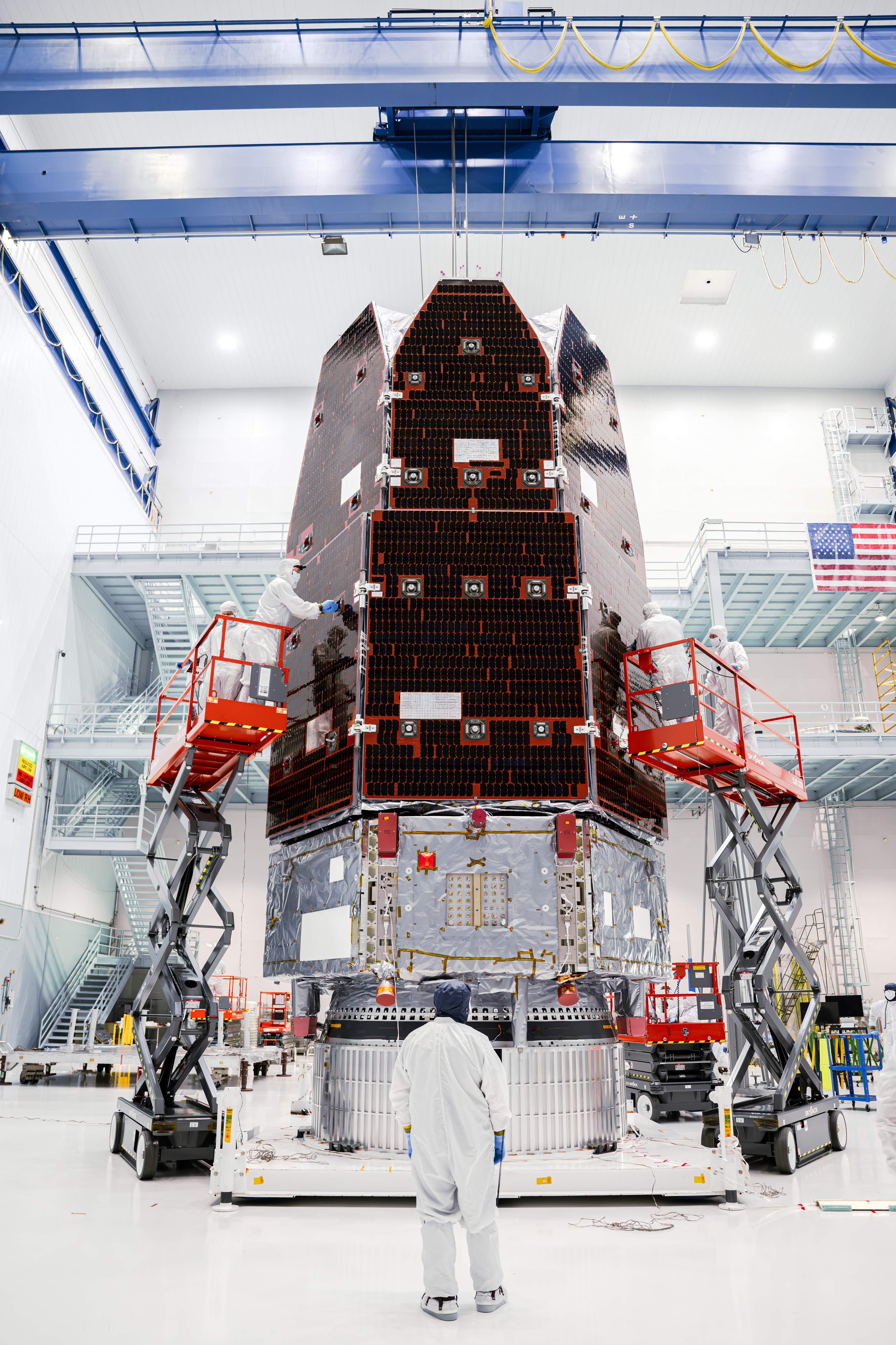 Workers finish assembling the Nancy Grace Roman Space Telescope in a clean room