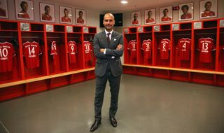 Bayern Muenchen new Head Coach Josep Guardiola visits the team locker room inside the Allianz Arena on the day he is unveiled as Bayern's new coach on June 24, 2013 in Munich, Germany.