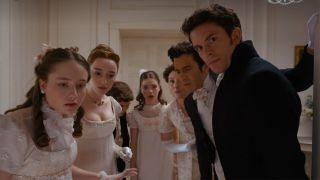 The Bridgertons gather around a door in Season 2 of the Netflix show.