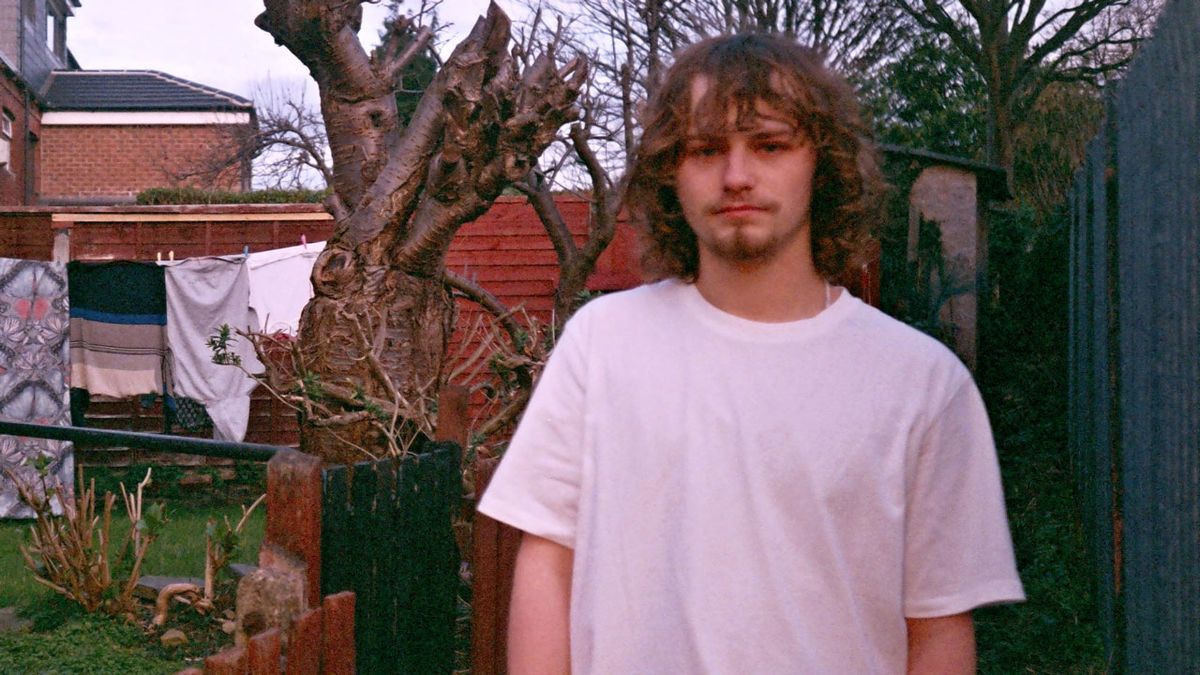 Levi Nice standing in the garden by some laundry