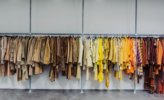 Hanging colour coded garments and jacket in the basement