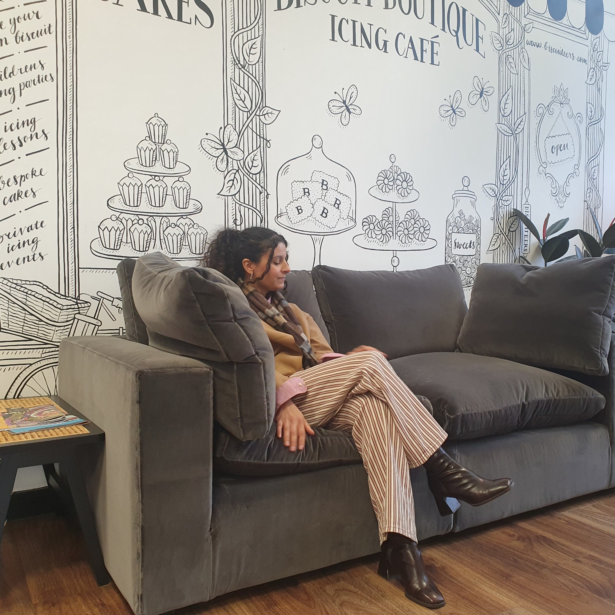 Sara sitting on the Wee Bonnie sofa from Schplendid at the brand&#039;s office