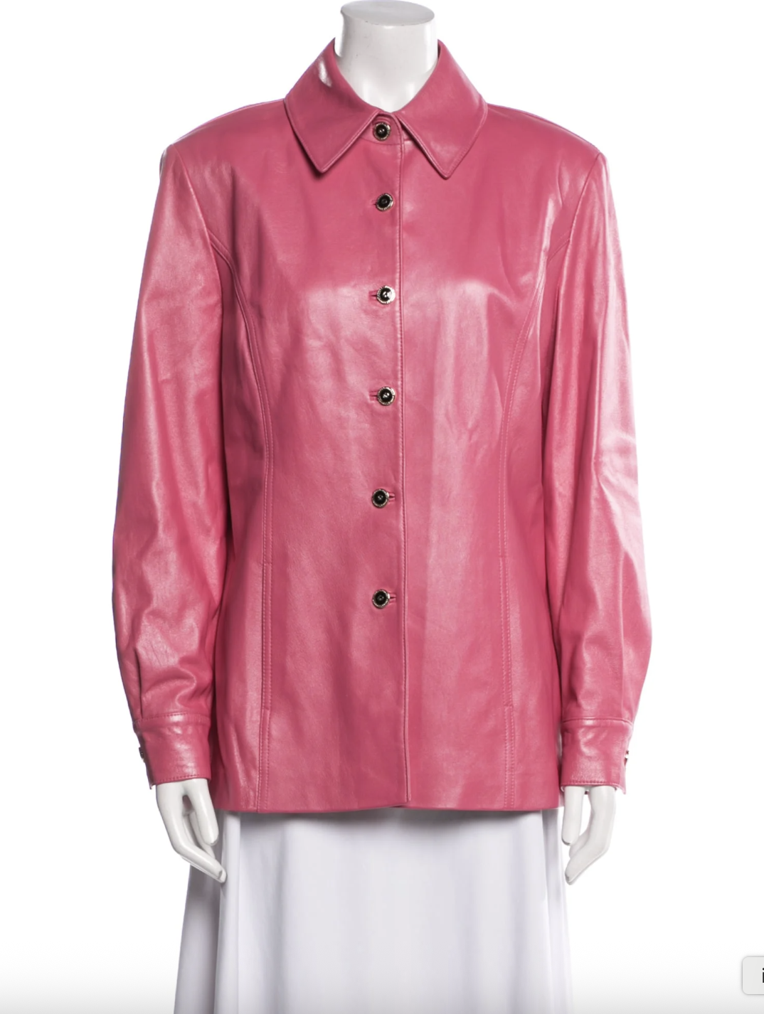 a pink coat in front of a plain backdrop