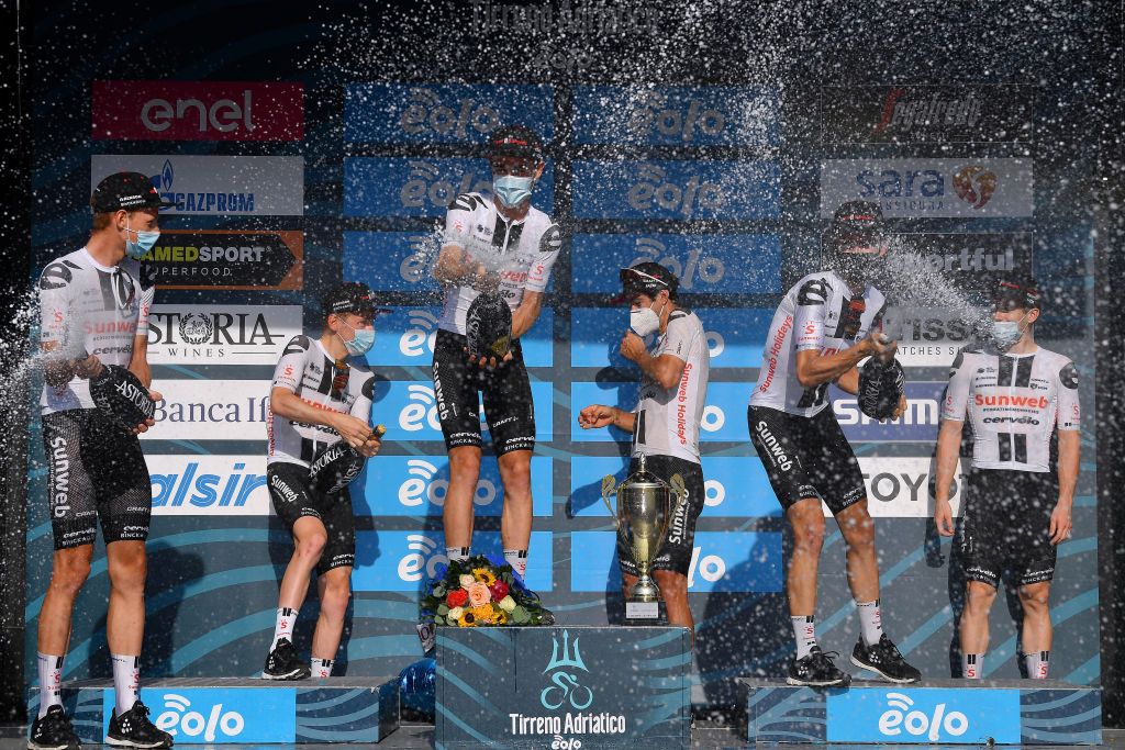 SAN BENEDETTO DEL TRONTO ITALY SEPTEMBER 14 Podium Michael Matthews of Australia and Team Sunweb Alberto Dainese of Italy and Team Sunweb Christopher Hamilton of Australia and Team Sunweb Jai Hindley of Austrailia and Team Sunweb Wilco Kelderman of The Netherlands and Team Sunweb Sam Oomen of The Netherlands and Team Sunweb Martijn Tusveld of The Netherlands and Team Sunweb Super Team Celebration Champagne Mask Covid safety measures during the 55th TirrenoAdriatico 2020 Stage 8 a 101km Individual Time Trial in San Benedetto del Tronto ITT TirrenAdriatico on September 14 2020 in San Benedetto del Tronto Italy Photo by Justin SetterfieldGetty Images