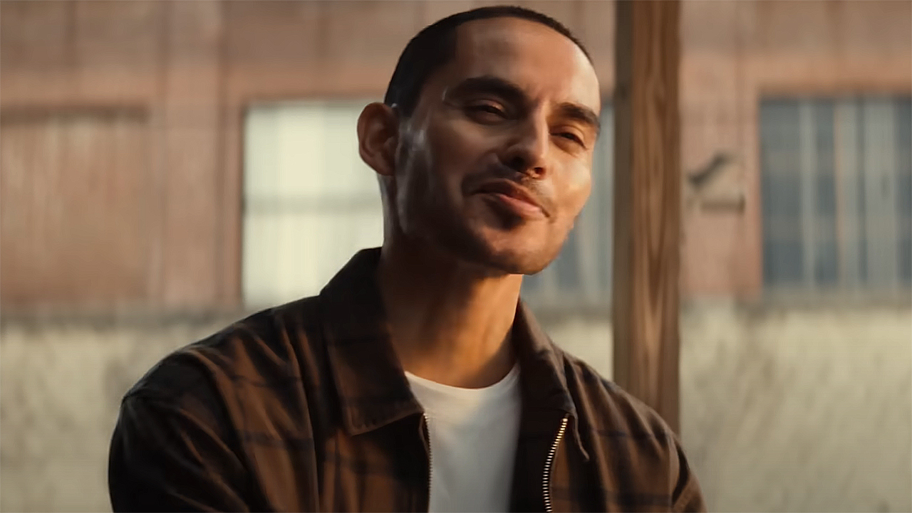 Cousin John smirking at an off-camera Riri in Marvel's Ironheart TV show