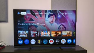 Philips OLED909 with Google TV home menu on screen