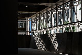 Sony Park Ginza and its brutalist volume, with meshed exterior and concrete interior