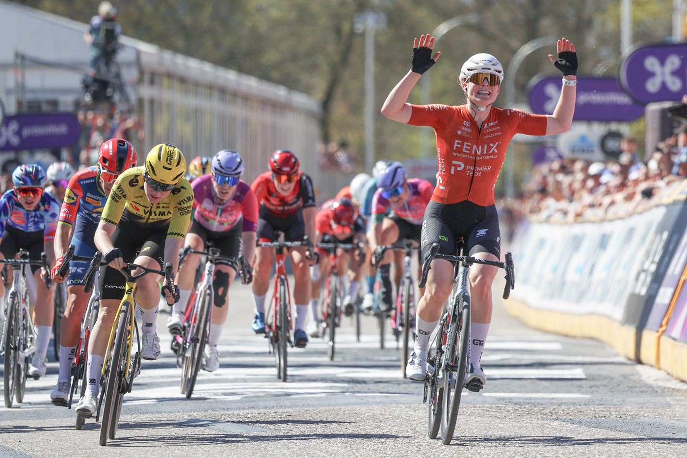 SCHOTEN, BELGIUM - APRIL 08: Charlotte Kool of Netherlands and Team Fenix-Premier Tech (R) celebrates at finish line as stage winner ahead of Nienke Veenhoven of Netherlands and Team Visma | Lease a Bike (C) and Elisa Balsamo of Italy and Team Lidl - Trek (L) during the 6th Scheldeprijs 2026, Women's Elite a 130.3km one day race from Schoten to Schoten / #UCIWWT / on April 08, 2026 in Schoten, Belgium. (Photo by Rhode Van Elsen/Getty Images)