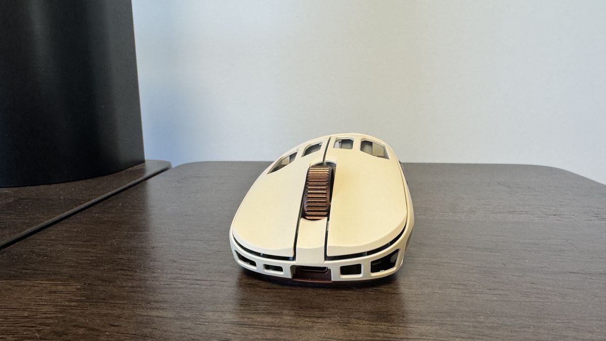The Pulsar Feinmann F01 Noctua Edition gaming mouse from the front on a wooden desk