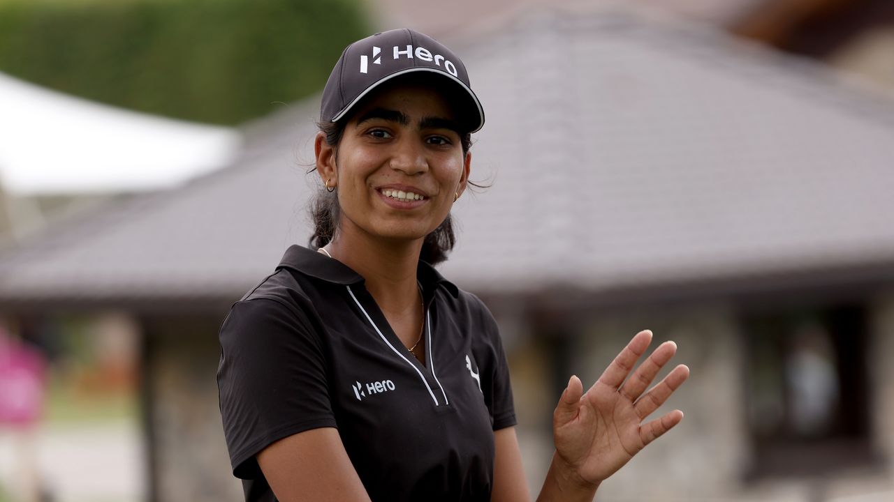 Diksha Dagar waves to the camera at the 2024 Evian Championship