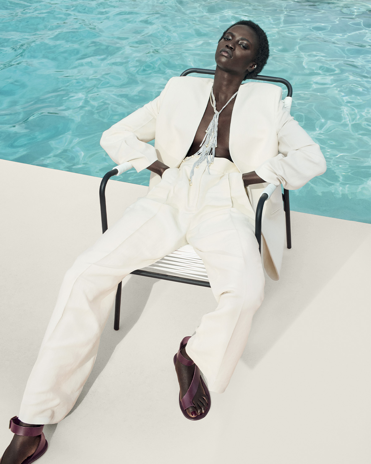 Model wears a white suit from the Victoria Beckham X Mango collaboration.
