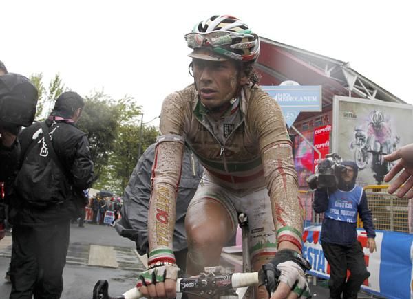 Filippo Pozzato (Team Katusha) raced to 33rd on a wet, muddy stage.