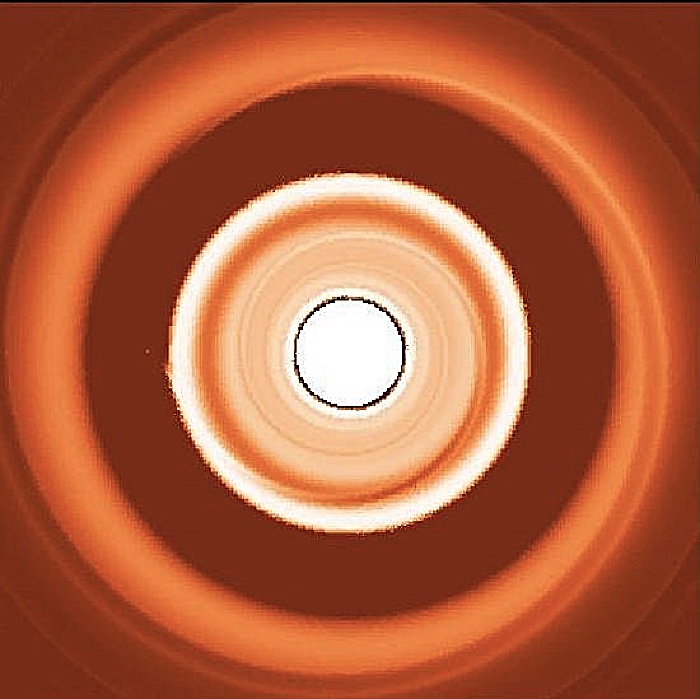 This simulated image shows the dust rings around a migrating exoplanet, with the small dust forming a ring interior to the planet and the large dust forming a ring on the outside of the planet.