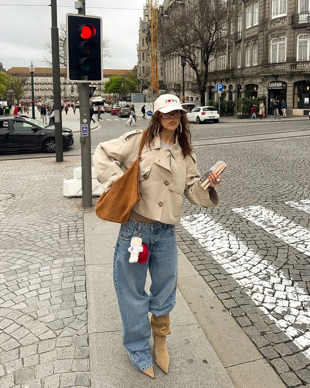Woman wearing a cropped trench coat outfit idea.