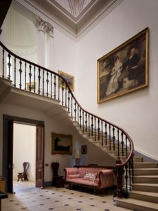 Fig 2: The domed staircase hall. John Higgins and his wife Martha are seen in the double portrait. Turvey House, Bedfordshire. ©Paul Highnam for Country Life