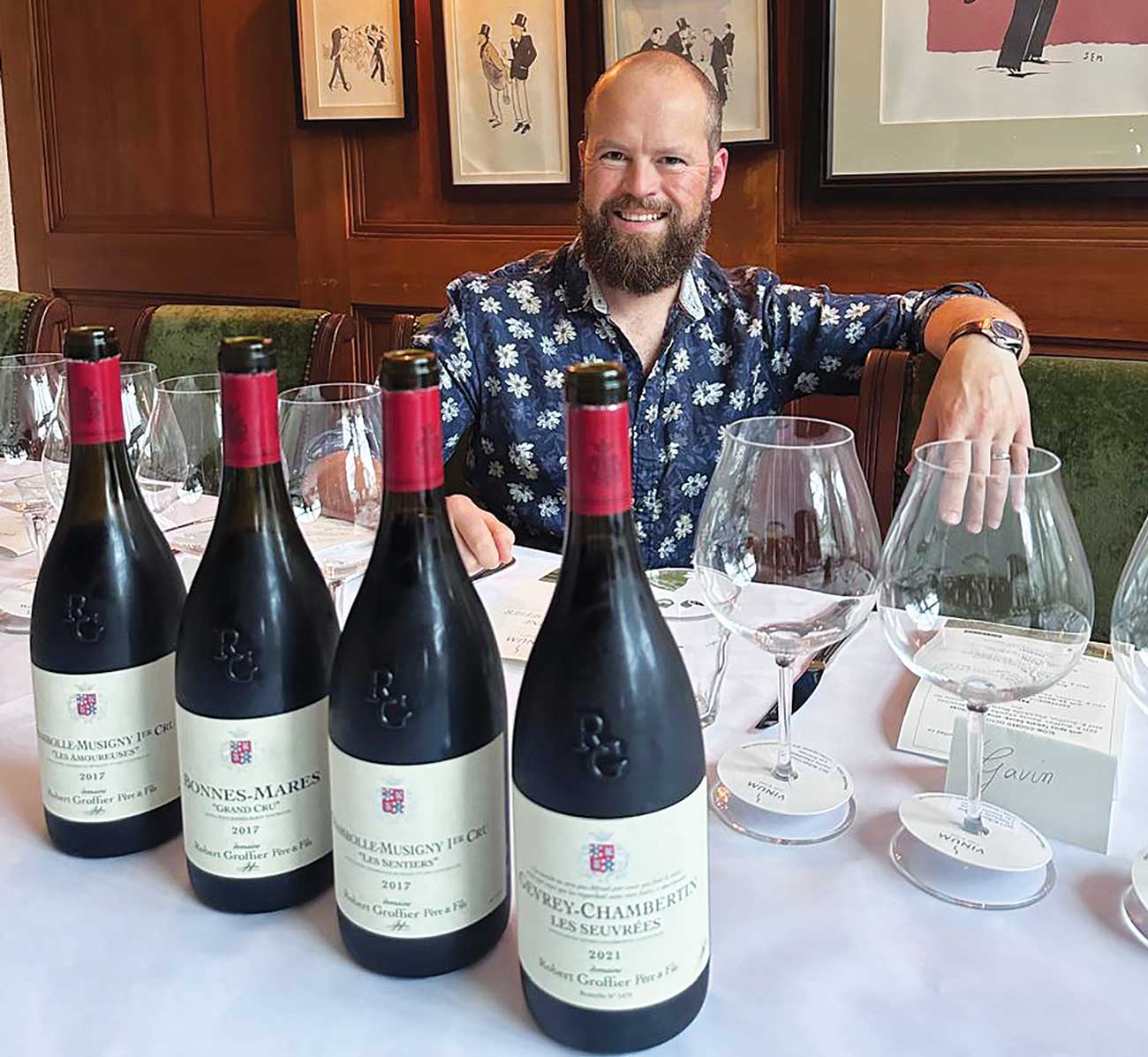 Matthew Hemming MW at table with bottles of wine