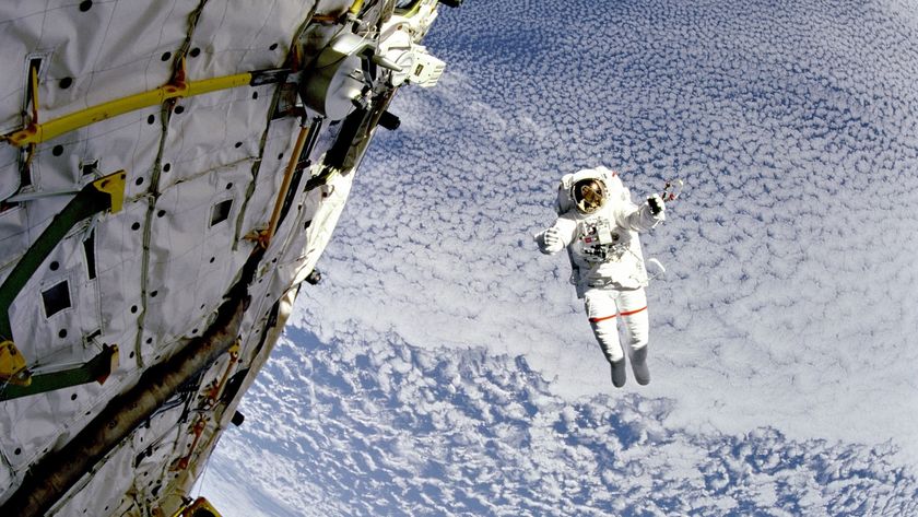 A photo of an astronaut floating outside of the ISS