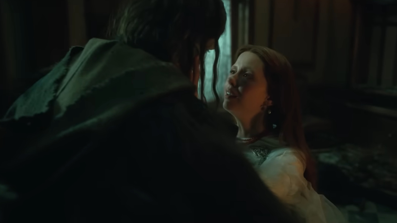 Mia Goth holding the Creature in Frankenstein