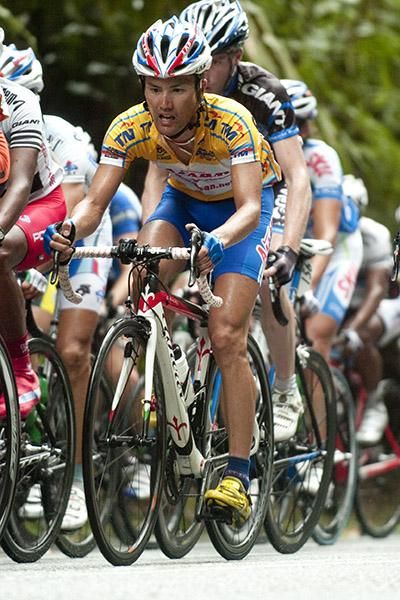 Tour leader Takeaki Ayabe (Aisan Racing Team) in the peloton moments before losing his grip with them.