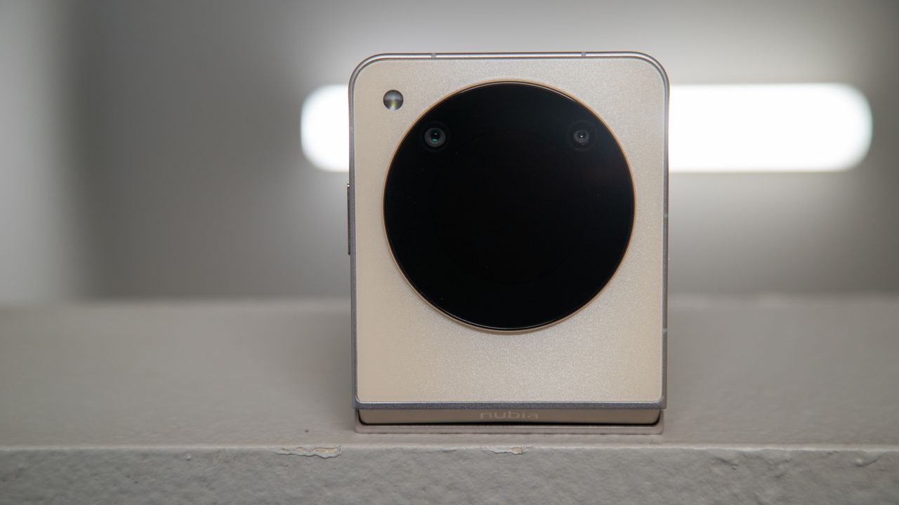 The Nubia Flip 5G on counter with a light behind it