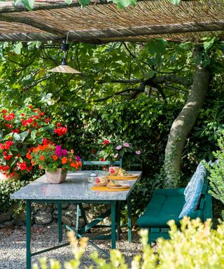 pergola with table and chairs