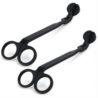 two black metal dancle wick trimming scissors on a white background