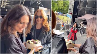 Sharon den Adel and Simone Simons hand a surprised-looking Cristina Scabbia a birthday cake