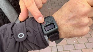 Remote control for an action camera strapped to a wrist