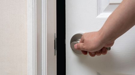 Man closing a door