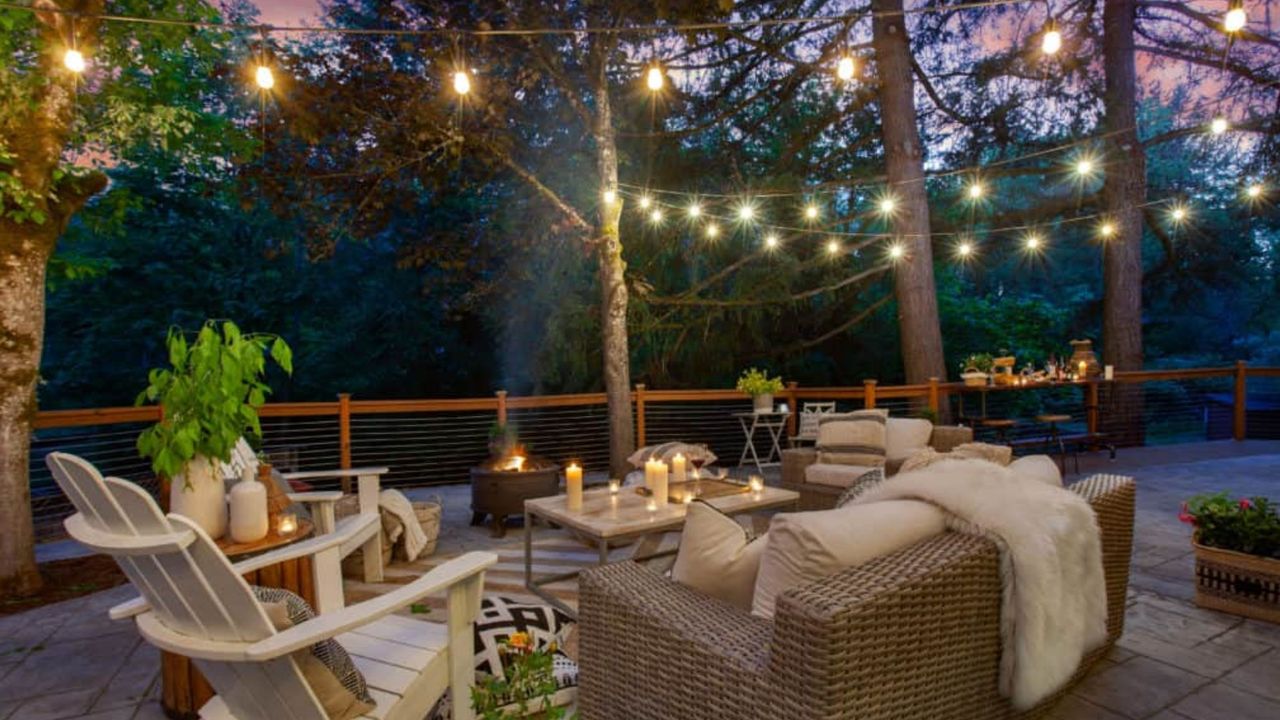 best outdoor lights lifestyle image with garden set up with chairs and table and decorative lights