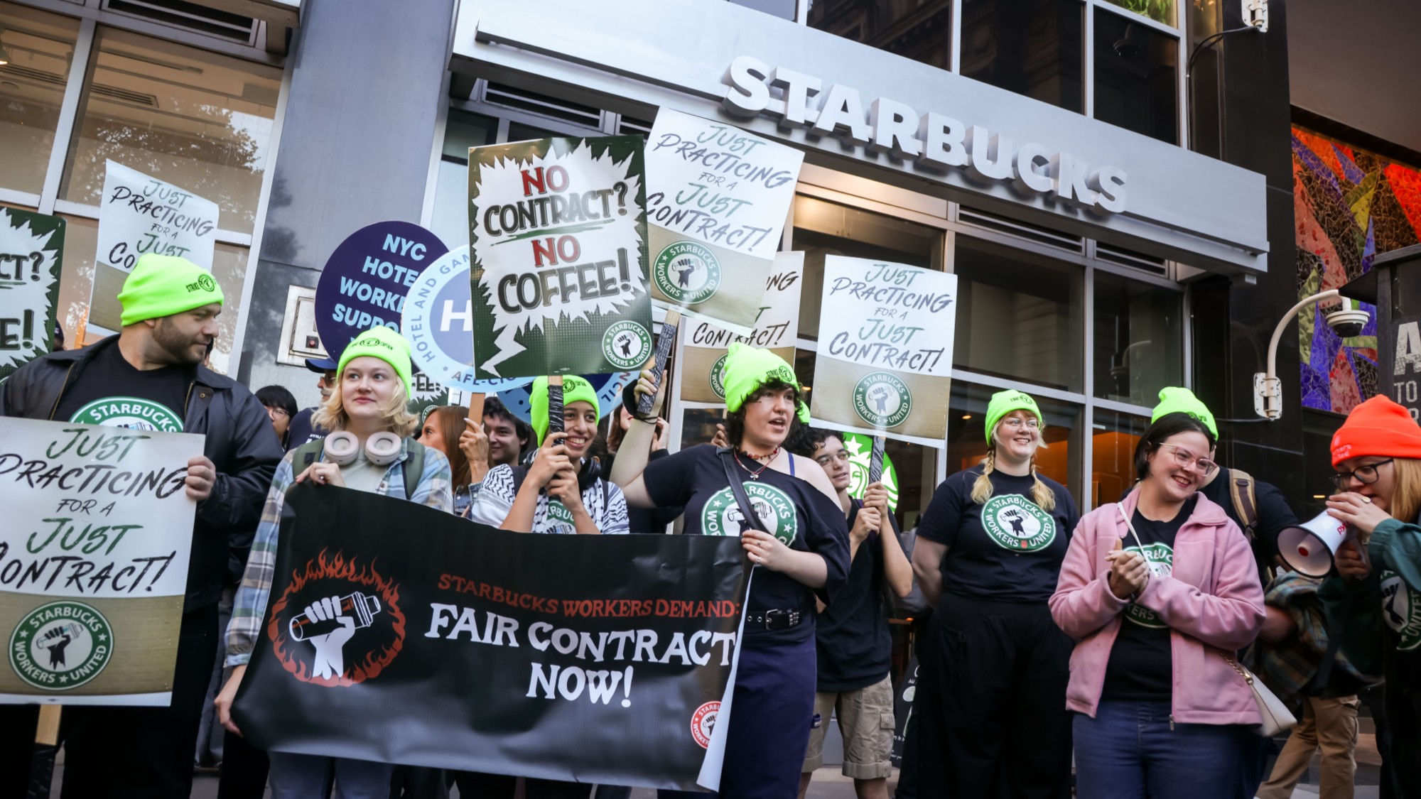 Workers picket outside a Starbucks store in New York City.
