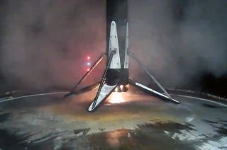 A SpaceX Falcon 9 rocket's first stage lands on the droneship "A Shortfall of Gravitas" after launching 23 Starlink satellites on Friday, Nov. 3, 2023. It was a record 18th landing for the booster.