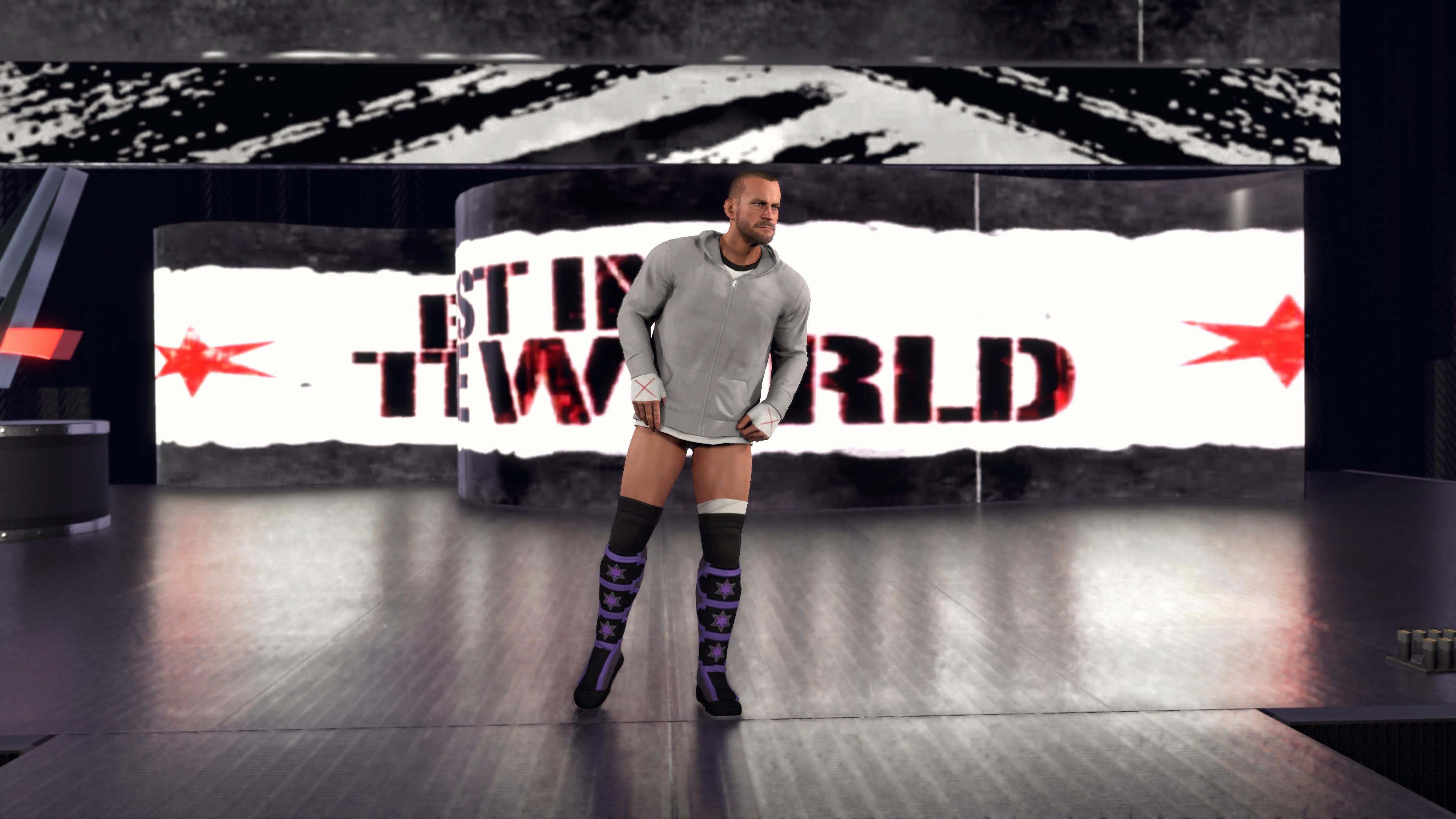 لقطات شاشة من داخل اللعبة من لعبة المصارعة WWE 2K26، تظهر المصارعين في الحلبة، وهم يقومون بالدخول، والساحة