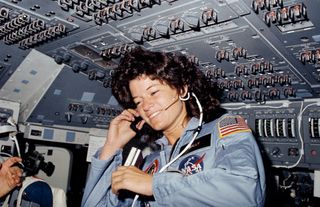 Seen on the flight deck of the space shuttle Challenger, astronaut Sally K. Ride, STS-7 mission specialist, became the first American woman in space on June 18, 1983.