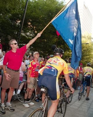 The Gusto Cycles team under the Carolina flag