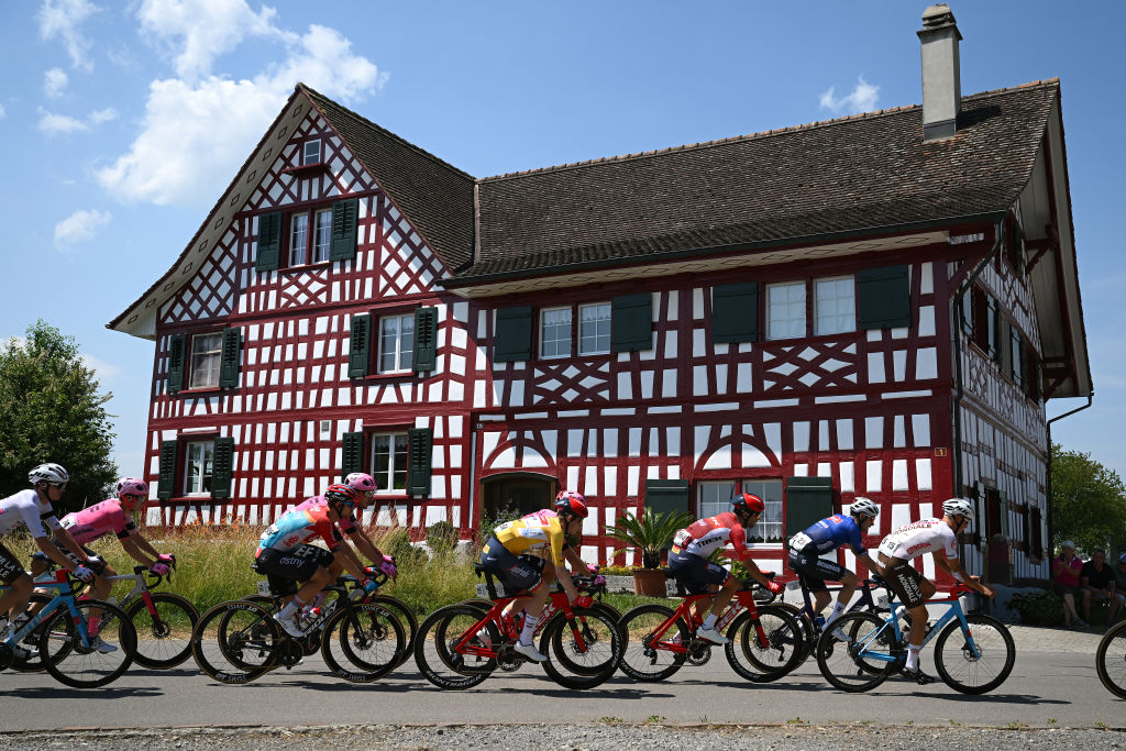 WEINFELDEN SWITZERLAND JUNE 17 LR Andreas Kron of Denmark and Team Lotto Dstny Mattias Skjelmose Jensen of Denmark and Team TrekSegafredo Yellow Leader Jersey Tony Gallopin of France and Team TrekSegafredo and a general view of the peloton competing during the 86th Tour de Suisse 2023 Stage 7 a 1835km stage from Tbach to Weinfelden UCIWT on June 17 2023 in Weinfelden Switzerland Photo by Dario BelingheriGetty Images