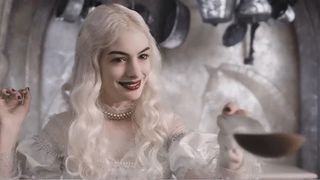 Anne Hathaway wears a white wig and red lips as the White Queen in 'Alice in Wonderland'