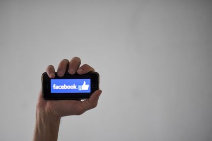 A smartphone with the Facebook logo