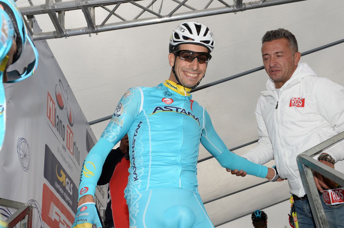 Fabio Aru makes his way off the sign on stage
