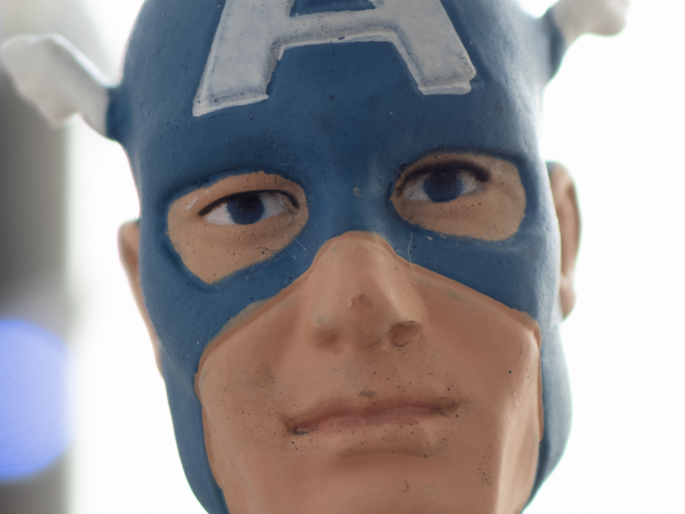 A miniature model of Captain America, photographed with the OM System OM-5 Mark II's regular and High Res Shot modes
