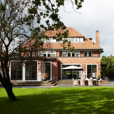 Exterior of 1930s house with modern extension at rear