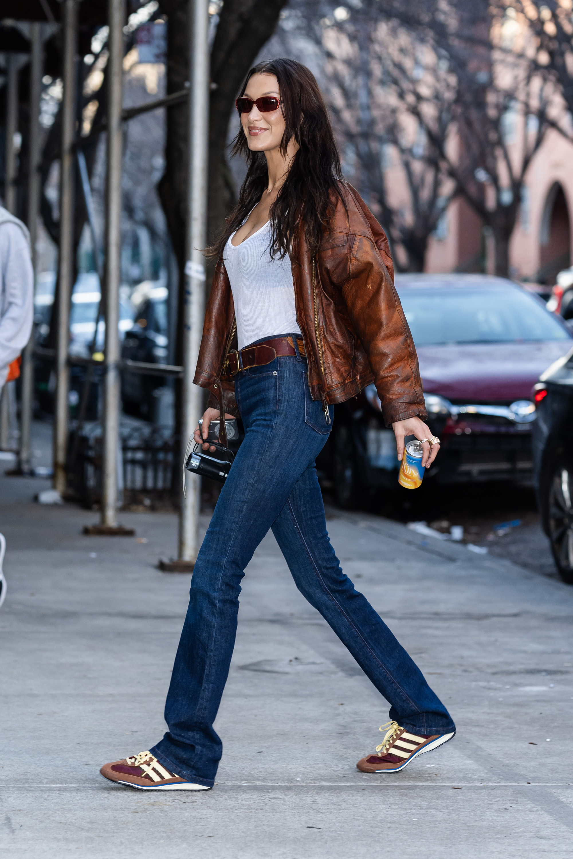 Bella Hadid wearing jeans and Adidas SL 72 sneakers in New York
