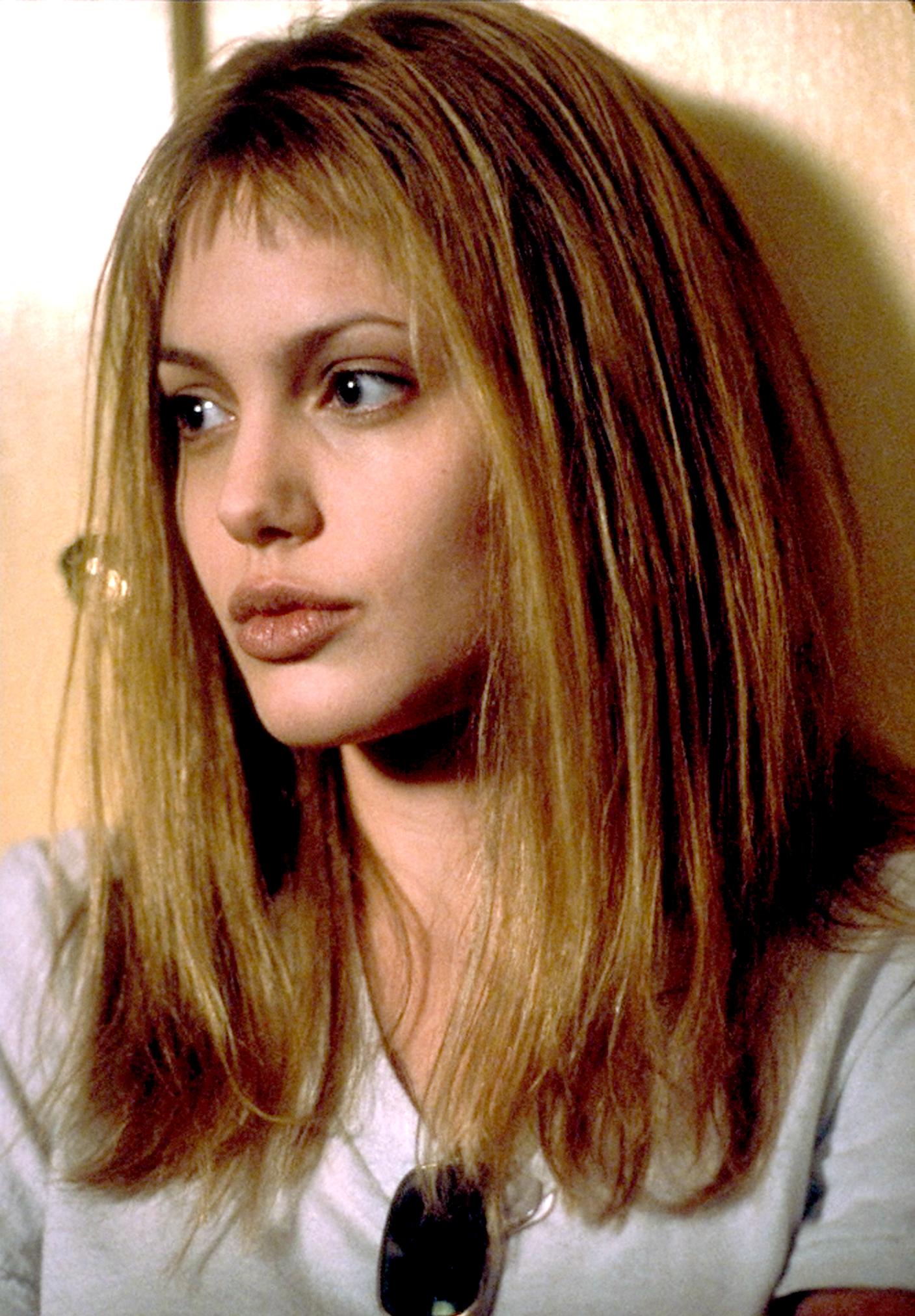 Two-time Golden Globe Award winner Angelina Jolie portrays Lisa, a seductive sociopath on the ward who befriends Susanna in the Columbia Pictures presentation, "Girl, Interrupted." Photo credit: Suzanne Tenner 1999 Columbia Pictures, Inc.