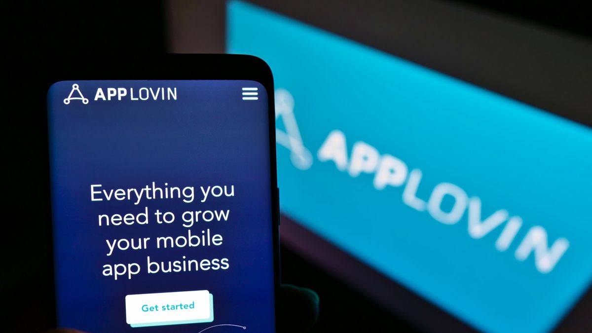 Mobile phone with website of US mobile technology company AppLovin Corp. on screen with logo