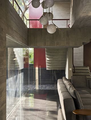 view across concrete levels inside Trees Sliced Through by Matharoo Associates